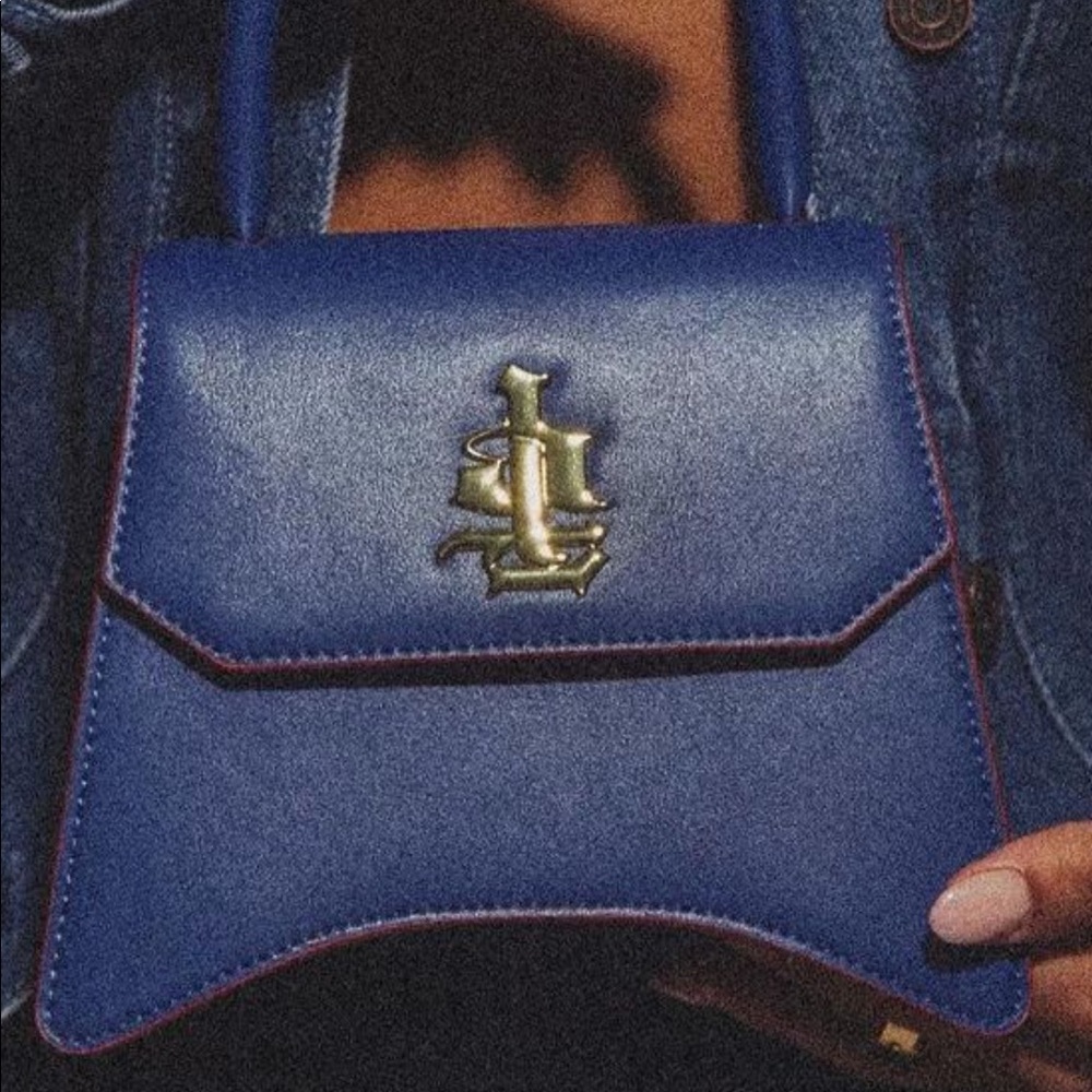 brand new blue purse comes with dust bag tags and everything. Black owned !!